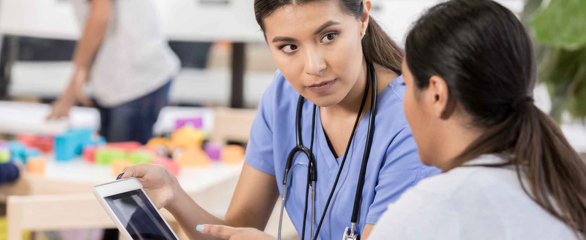 Female doctor talking with patient